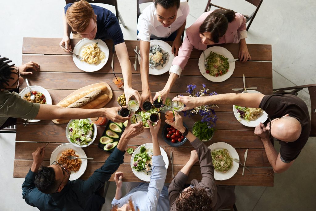 Table with people making a toast