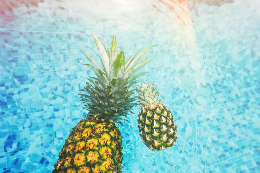 Pineapples floating in water