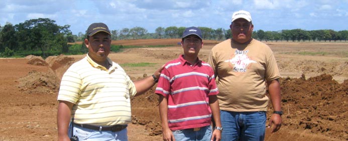 Didier Castro, Oscar A. Obando and Denyer Perez overseeing drainage excavation.